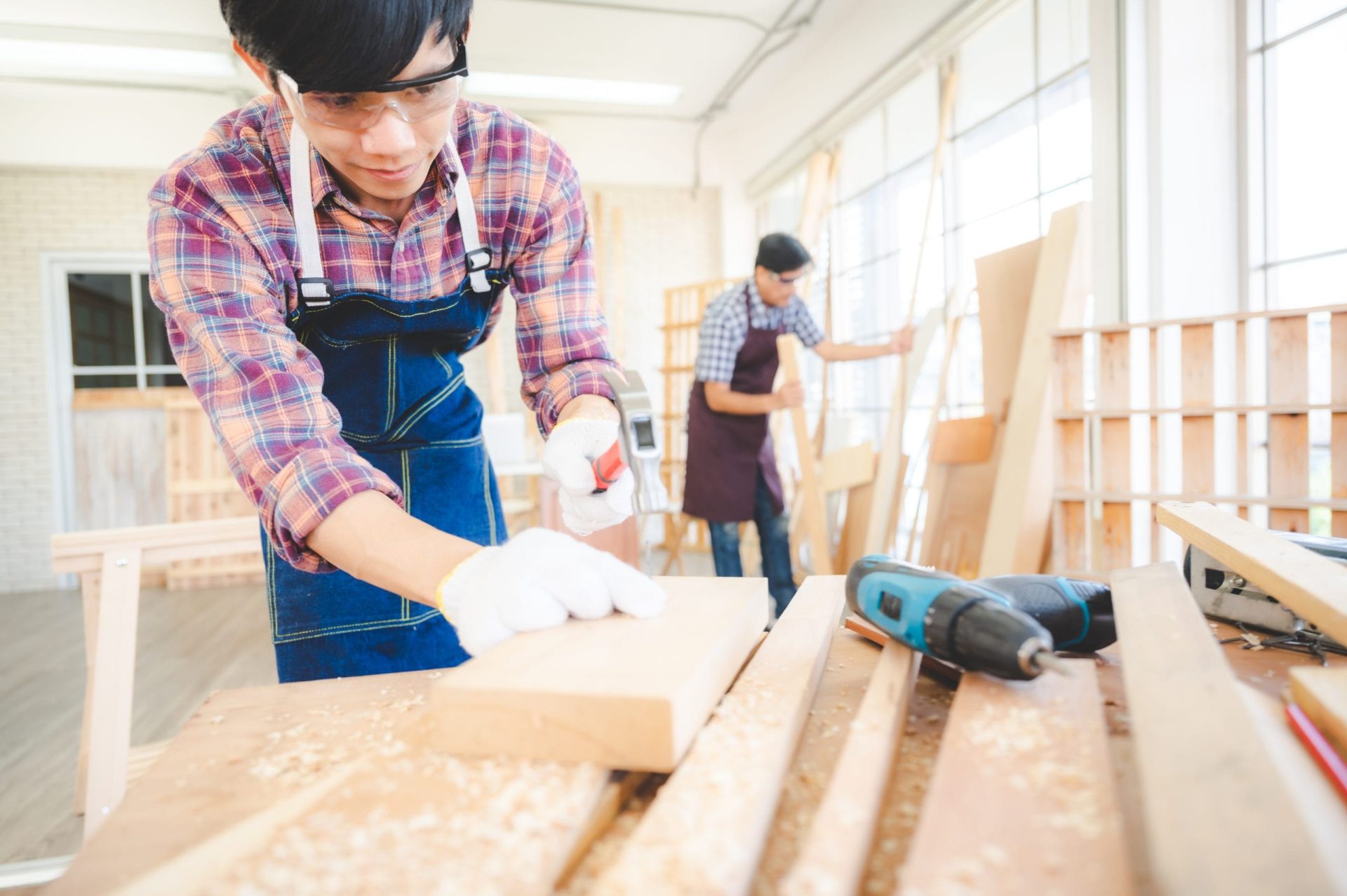 wooden workshop concept, carpenter team craftsman person working with a wood work construction tool